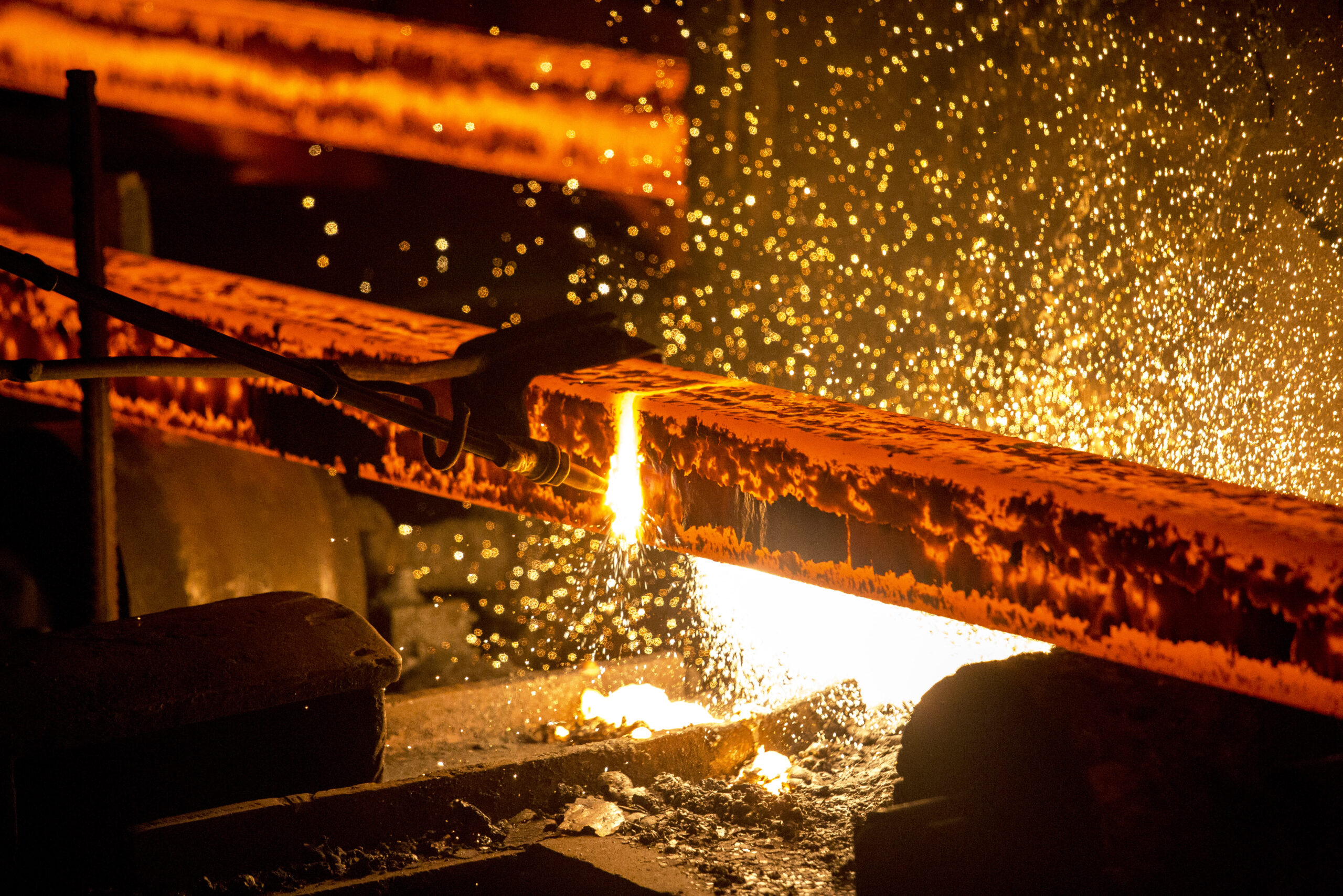 Gas cutting of the hot metal in steel plant at Demra, Dhaka, Bangladesh